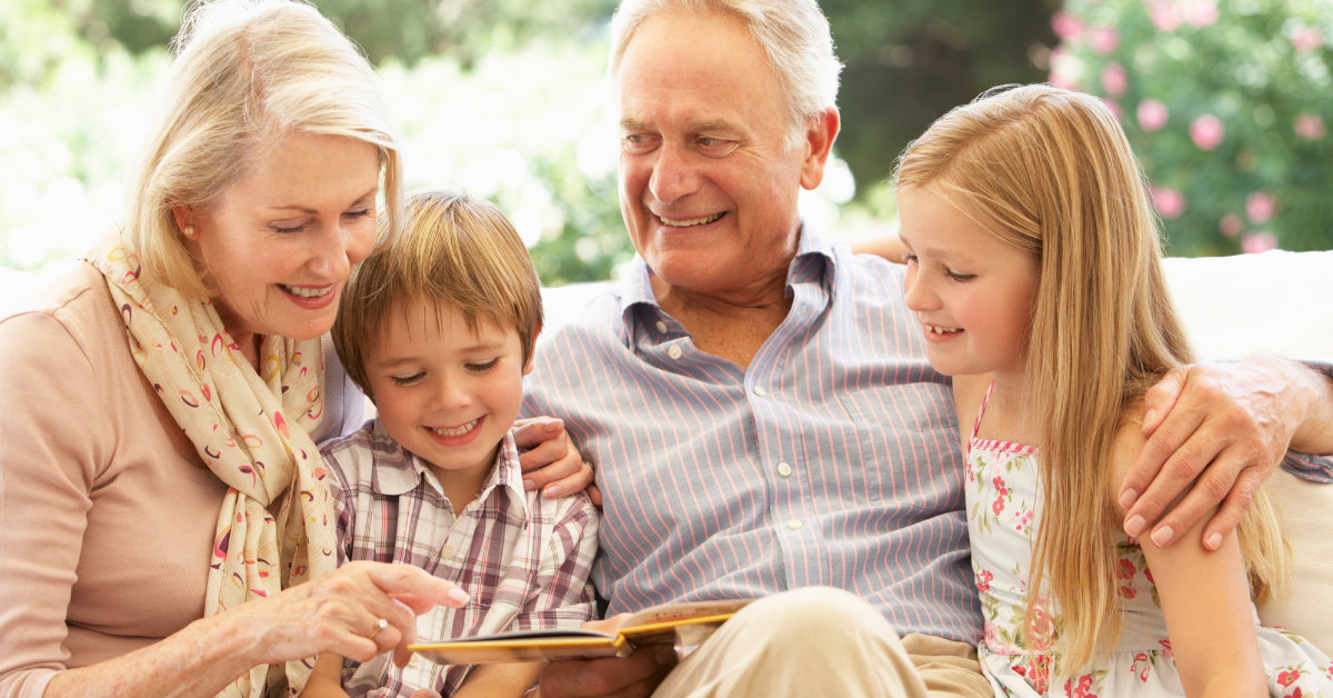 senior grandparents with little boy and girl